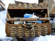 A Victorian rush and cane sewing basket with carrying handle, and opening to reveal padded lined