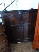 18th century oak hanging corner cupboard, with cavetto cornice, plain frieze and pair framed panel