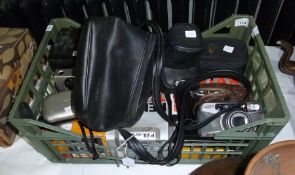 Quantity of camera equipment to include a Cannon Ixus camera, an Olympus SLR, Pentax cameras, a