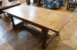 Antique oak refectory dining table, on turned supports united by stretcher, 210cm long