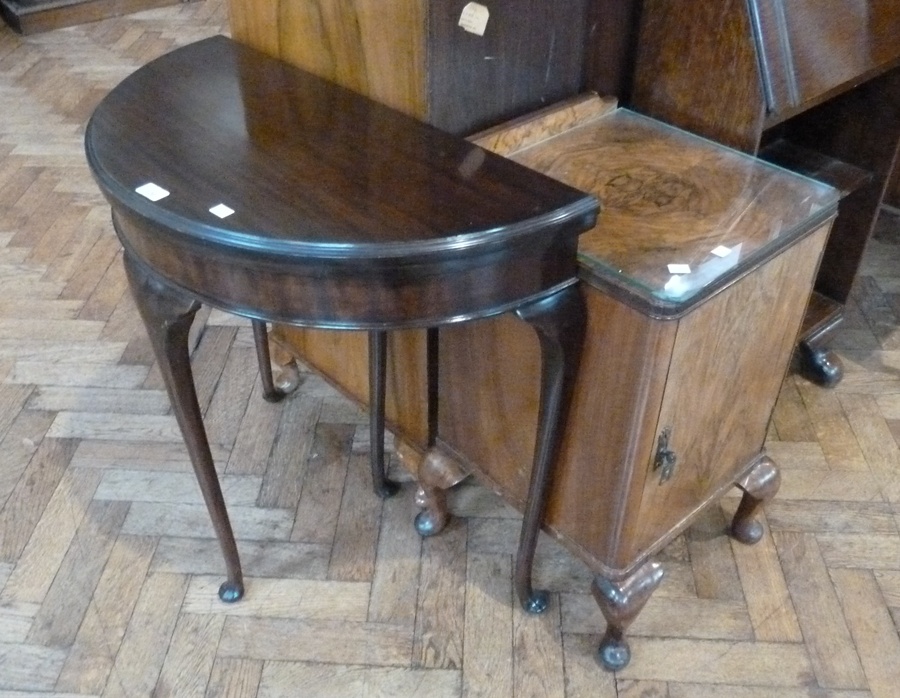 Modern mahogany demi-lune side table, and an early twentieth century walnut pot cupboard, on