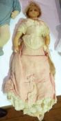 Victorian wax shoulder  head doll, with blue fixed eyes, fair haired wig, with soft body and wax