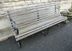 Slatted wood and cast iron garden bench