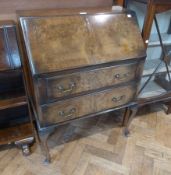 Twentieth century walnut bureau, hinged top enclosing pigeonholes and drawers to two long drawers