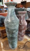 Two large antique style urns, one in green and the smaller one in red (2)