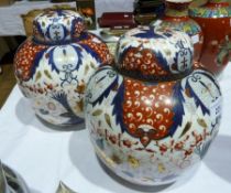 Pair large Continental porcelain ginger jars and covers, ovoid and decorated in the Japanese Imari