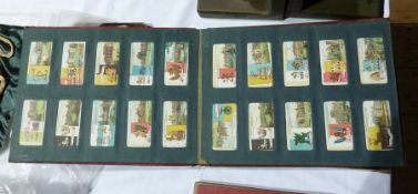 A Wills cigarette card album containing various Series to include:- flags, stately homes, etc.