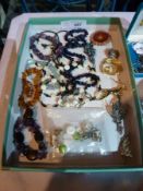 Quantity of costume jewellery to include:- brooches, earrings, semi-precious stone necklaces etc (