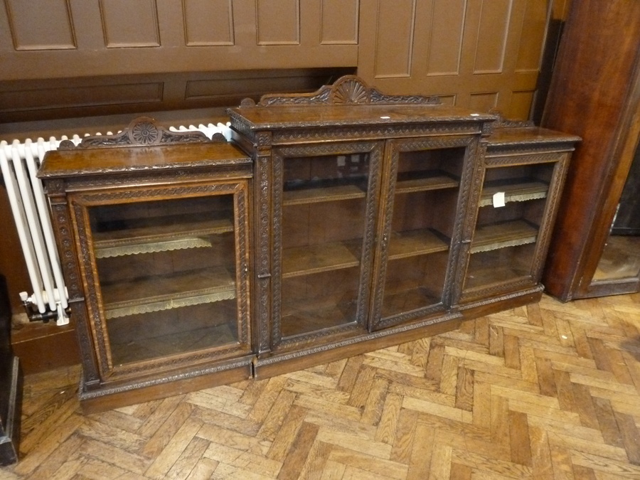 Victorian oak glass fronted display cabinet, of three adjoining pieces, carved borders, the middle