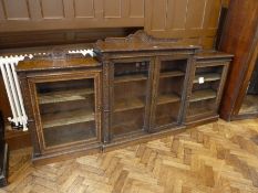 Victorian oak glass fronted display cabinet, of three adjoining pieces, carved borders, the middle