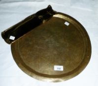 A set of four Art Nouveau style brass door finger plates, together with an Eastern brass circular