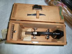 An SEL microscope within a fitted travelling box and a slide drawer