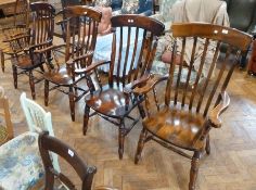 Set of four Victorian style lathback armchairs, with solid seats, on ring turned legs with H-