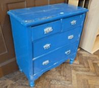 Painted blue pine chest of two short  and two long drawers on turned supports, with metal handles,