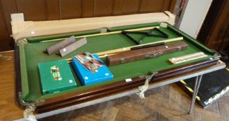 Table top snooker table with accessories, to include snooker balls,  pool balls, five cues, (one