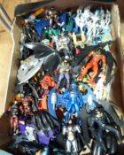 Two boxes of Batman figures in various costumes