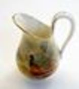 Royal Worcester porcelain miniature ewer, painted with pheasant by Jas Stinton, signed, 6.5cm high