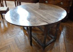 18th century oak gateleg table, on turned supports united by stretchers, 132cm wide