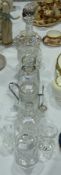 A cut glass decanter, glass vase, other decanters and items (8)