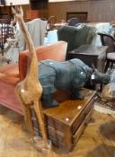 A large painted plaster rhino and a wooden giraffe (2)