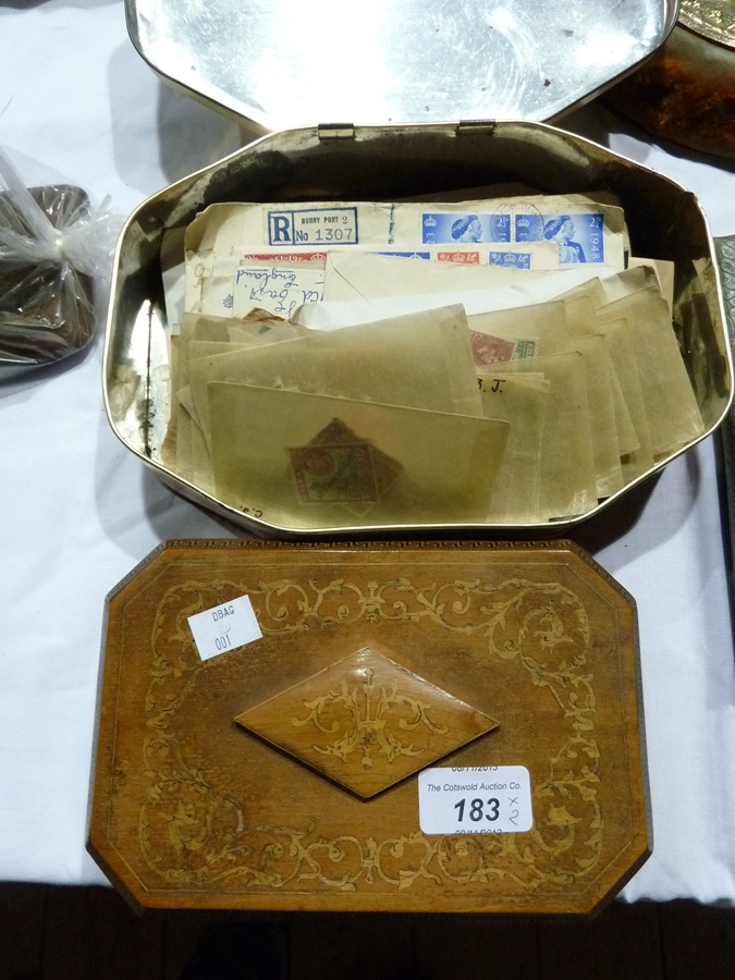Floral inlaid octagonal box enclosing a quantity of old stamps, and further loose stamps in an old