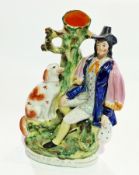Staffordshire pottery spill vase figure group, "Dog Tray", man seated with dog