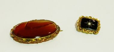 Victorian agate brooch, oval, and a nineteenth century gilt metal and black enamel mourning