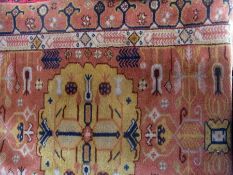 A Persian design wool runner, pale brown with central yellow medallions within multiple borders