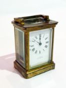 A French carriage clock timepiece with brass case, and bevelled glazed panels, retailed by Jack &