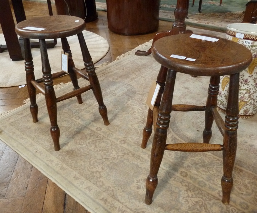 Pair Victorian elm and hardwood kitchen stools, each circular on baluster ring turn supports and