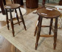 Pair Victorian elm and hardwood kitchen stools, each circular on baluster ring turn supports and