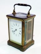 A French timepiece carriage clock in brass case with glazed panel sides, enamel dial, height 13cm