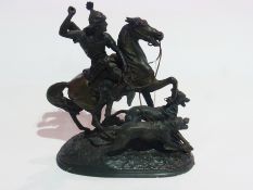 A figure of archer on horseback with hounds, with signature to base "Waheen"