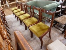 Set of six early nineteenth century regency inlaid mahogany dining chairs, each with strung carved