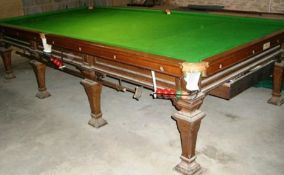 Full sized billiard table with scoreboard, rules, overhead hanging light, rest and cues etc by