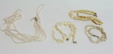 Three-strand freshwater pearl necklace, having silver clasp, two mother-of-pearl type necklaces, and