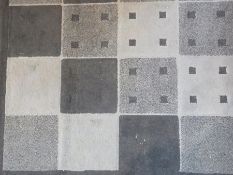 Modern rectangular blue rug with alternate patterned blue squares