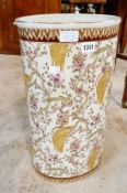 Ceramic stickstand, oval, allover decorated with exotic birds in pink flowering trees, foliate