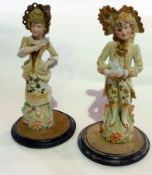 Pair continental tinted bisque figures in revived 18th century style, lady and gentleman, one having