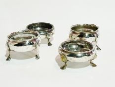 Pair Georgian circular silver open salts, raised on pad feet, London 1747, and another pair,