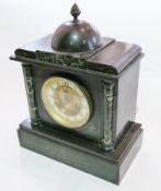 A Victorian slate mantel clock, with green veined marble pillars, the dial with enamel chapter ring,