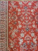 A Persian design wool runner, with red field, overall floral design, multiple borders