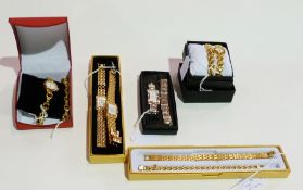 Five boxed lady's wristwatches, on gold-coloured and stainless steel bracelets etc.