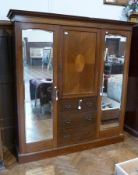 Edwardian compactum, with plain and cavetto cornice, inlaid frieze, central hat cupboard enclosed by