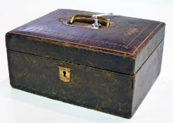 Leather bound jewellery box, with brass carrying handle, the interior with fitted blue velvet tray