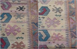 Two Egyptian Oriental weaver's gabbeh rugs, with stylised geometric designs within a beige field and