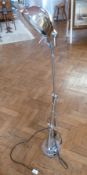 Pair Ralph Lauren chromium plated adjustable cantilever floor standing lamps, each on circular base