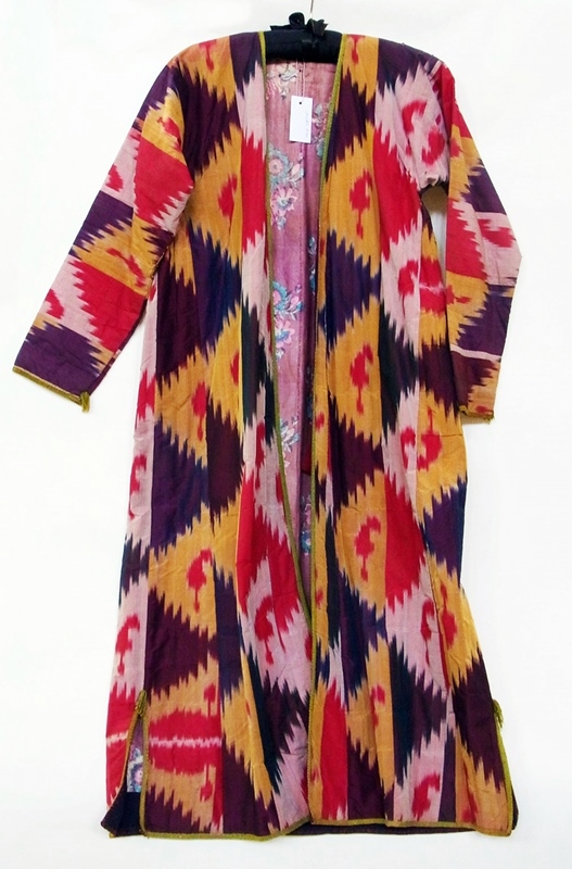 A vintage silk robe, multi coloured, lined with chintz, braided collar and cuffs, slightly padded,