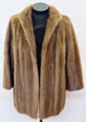 A brown mink jacket, three-quarter length, with embroidered lining