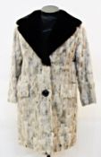 A vintage fur coat (possibly goat) the collar trimmed with black fur, made by "CHR Smith of Bath and